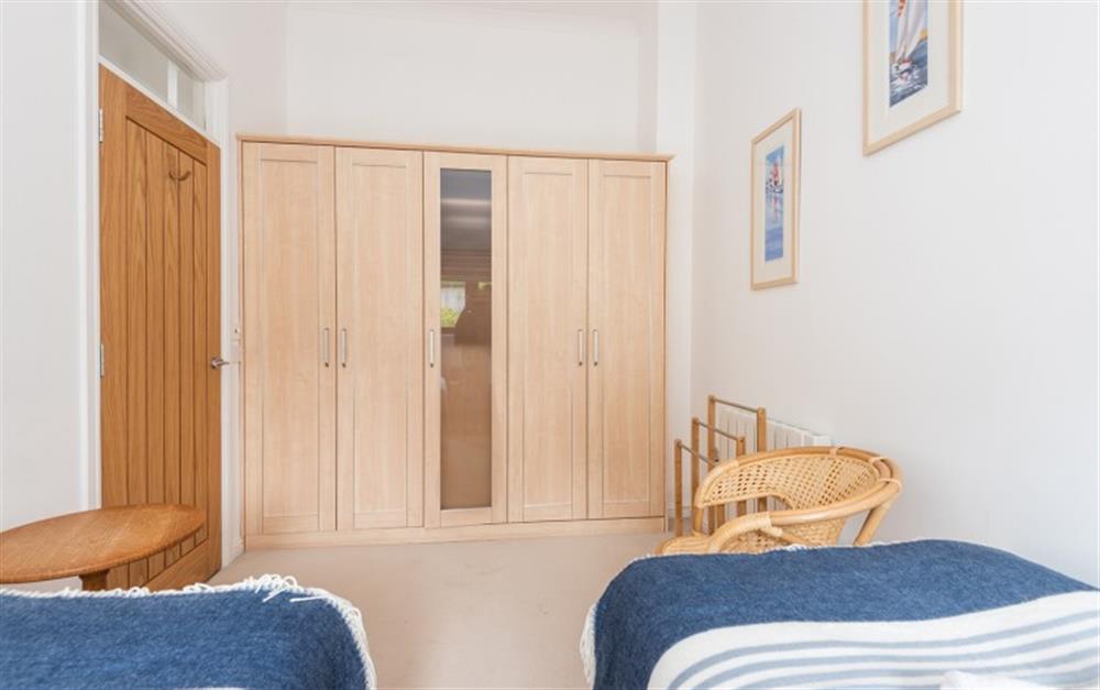 The twin bedroom has plenty of hanging space in the large wardrobe  at Finders, 87 Keeper's Cottage in Maenporth