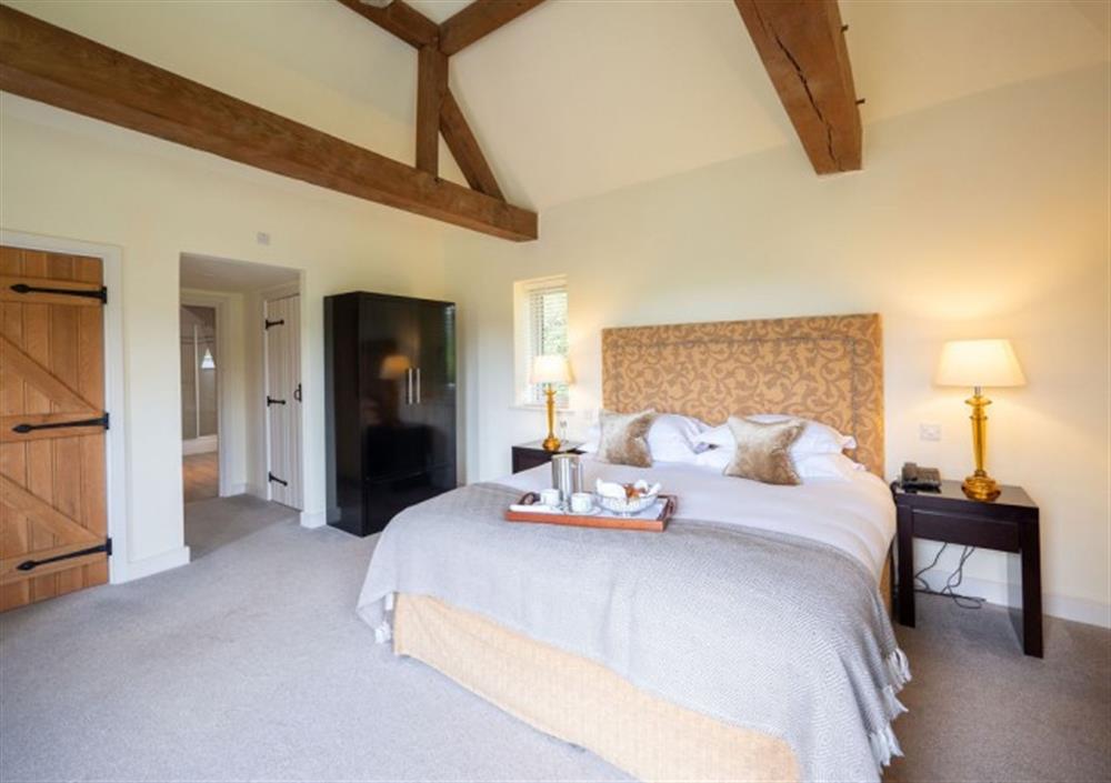 Bedroom 1 with exposed solid oak beams at Fingle Bridge in Chagford