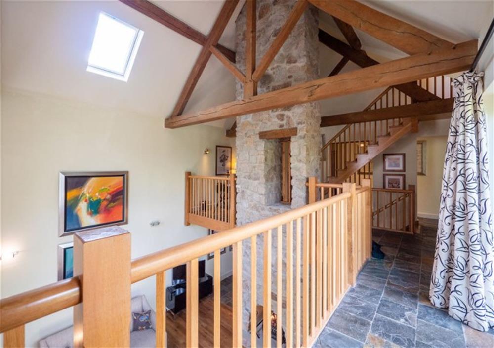 Mezzanine level overlooking the sitting room and with double doors to decked terrace at Fingle Bridge in Chagford