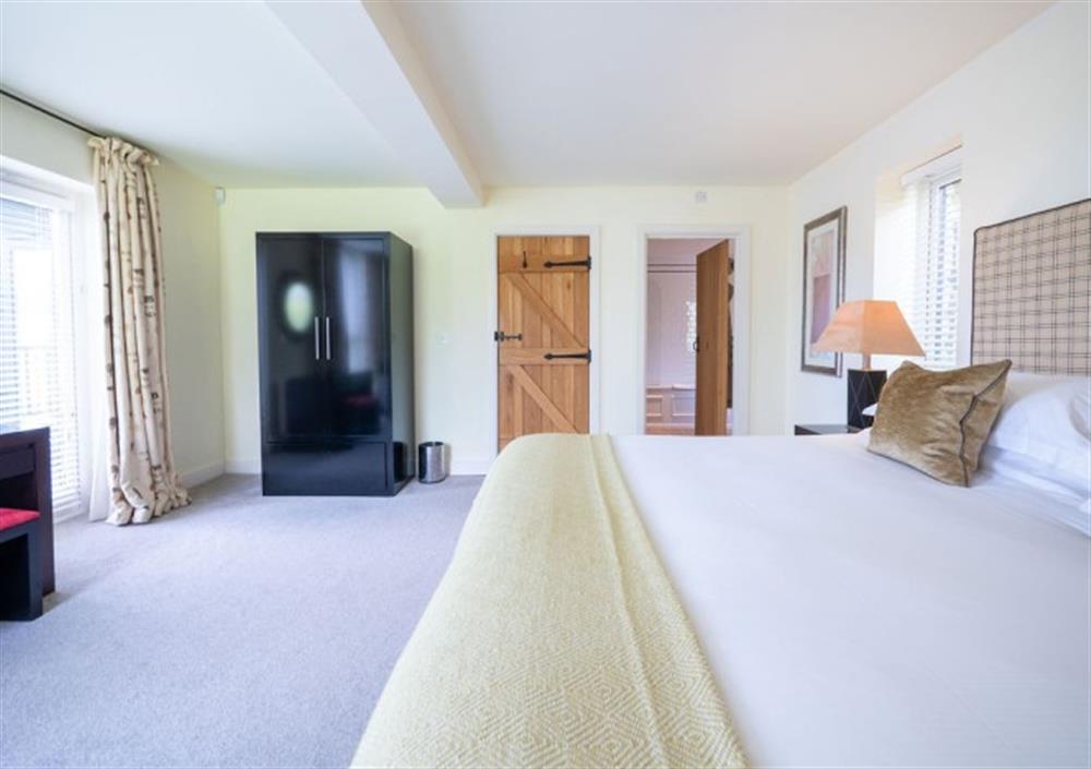 Spacious Bedroom 2 with door to ensuite bathroom at Fingle Bridge in Chagford