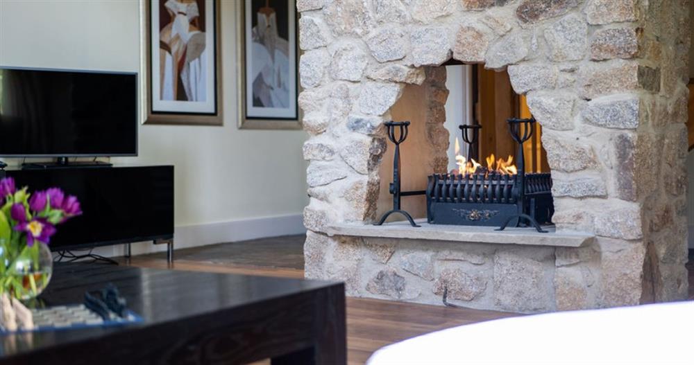 Stone feature fireplace with gas fire at Fingle Bridge in Chagford