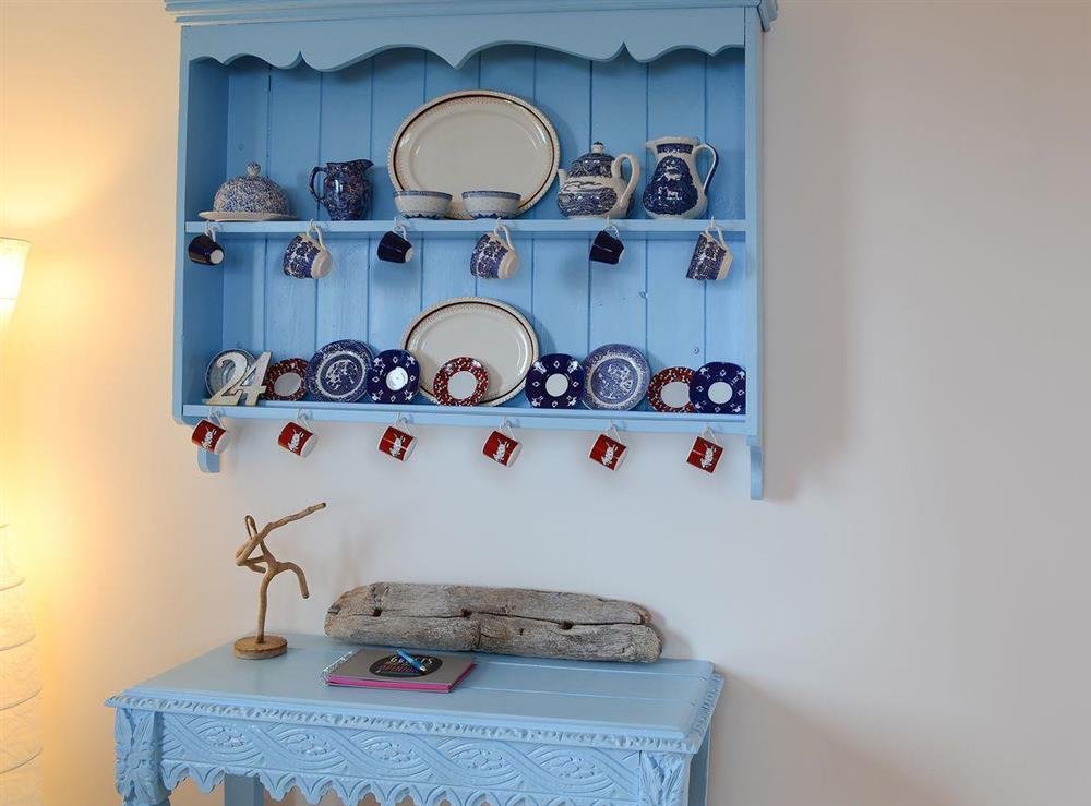 Delightful shabby chic features adorn the walls