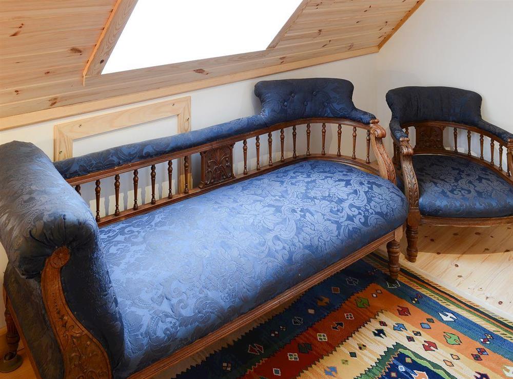 The landing is home to a comfortable chaise longue at Fionn Croft Lodge in Gairloch, Ross-Shire
