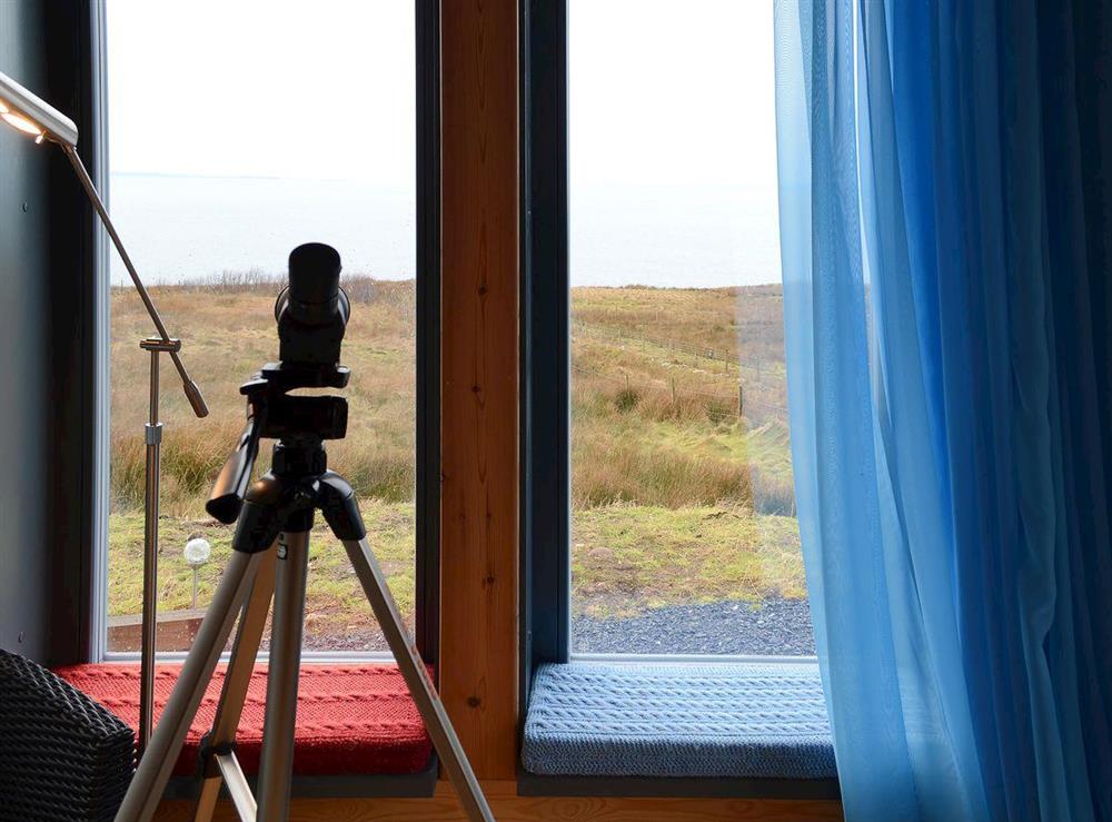 The living room affords spectacular views towards the Hebrides at Fionn Croft Lodge in Gairloch, Ross-Shire
