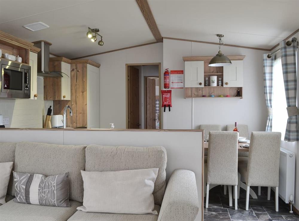 Open plan living space at Fir Tree Lodge in Aviemore, Highlands, Inverness-Shire