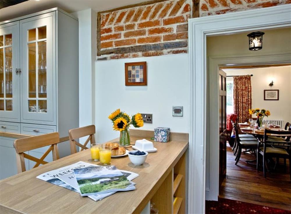Charming kitchen and adjacent dining area at Firestone Lodge in , Wootton