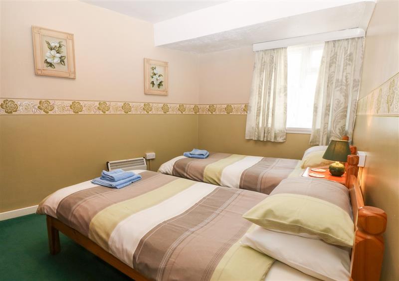 One of the bedrooms at First Floor Apartment, Tremadog