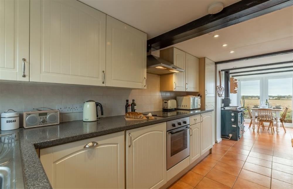 Ground floor: Galley kitchen with dining conservatory at First & Last, Trimingham near Norwich