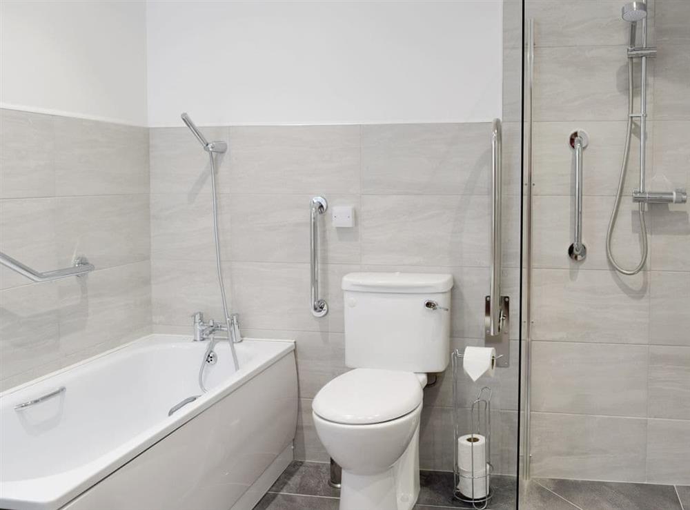 Bathroom with bath and walk-in shower cubicle at Oak Cottage, 