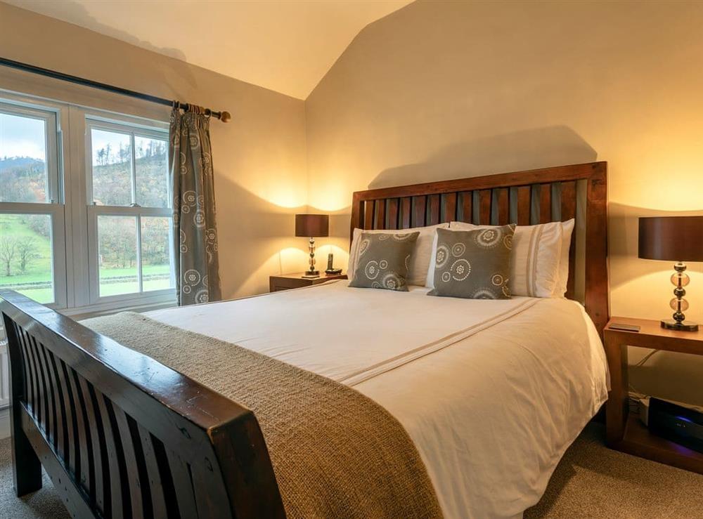 Comfortable bedroom with kingsize bed and en-suite at Fisher Place in Thirlmere, near Keswick, Cumbria