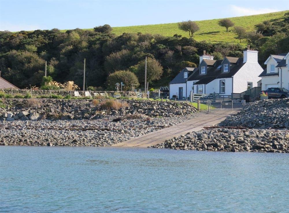 View of the cottage from the sea at Fishermans Cottage in Newton Stewart, Wigtownshire