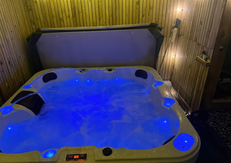 Enjoy the hot tub at Fishermans Cottage, Prestatyn