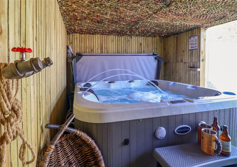 Spend some time in the hot tub at Fishermans Cottage, Prestatyn