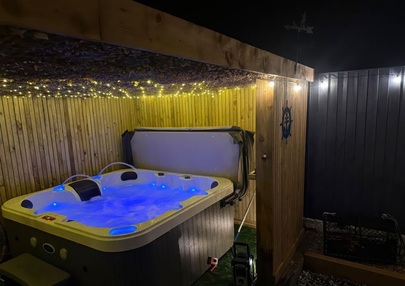 There is a hot tub at Fishermans Cottage, Prestatyn