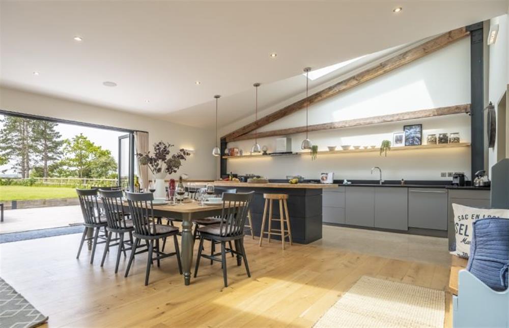Contemporary kitchen with dining table and great access to the garden at Fitters Barn, Warham