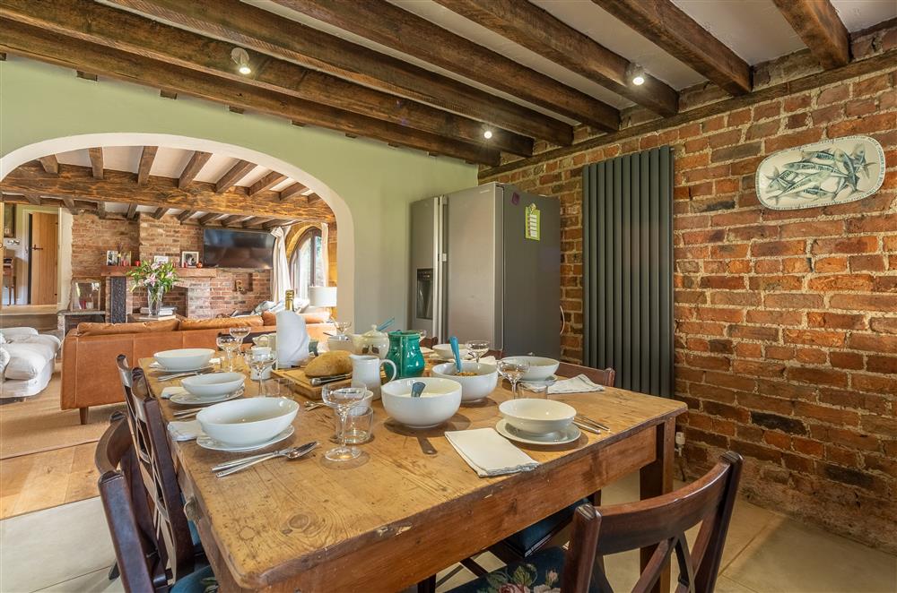 Dining area with large oak table at Five Acres, Boltby
