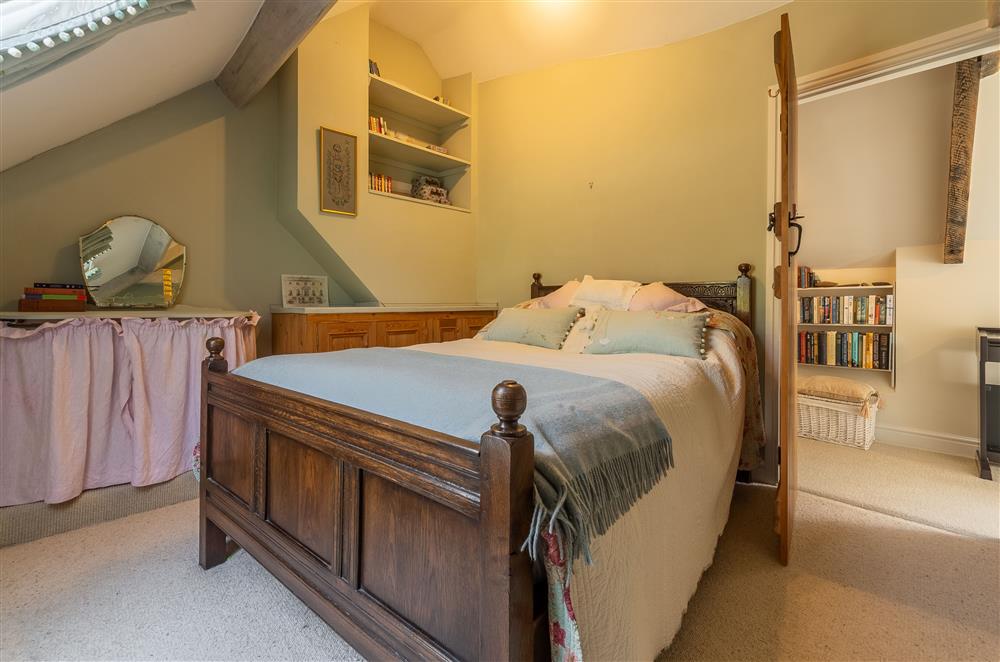 Double bedroom with decorative shelving at Five Acres, Boltby