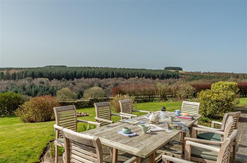 Garden furniture on the terrace and views of the hills at Five Acres, Boltby