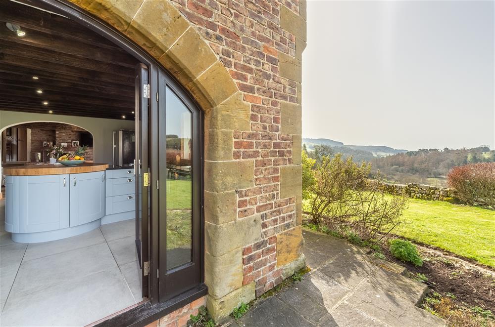Kitchen leading to outdoor patio with magnificent views at Five Acres, Boltby