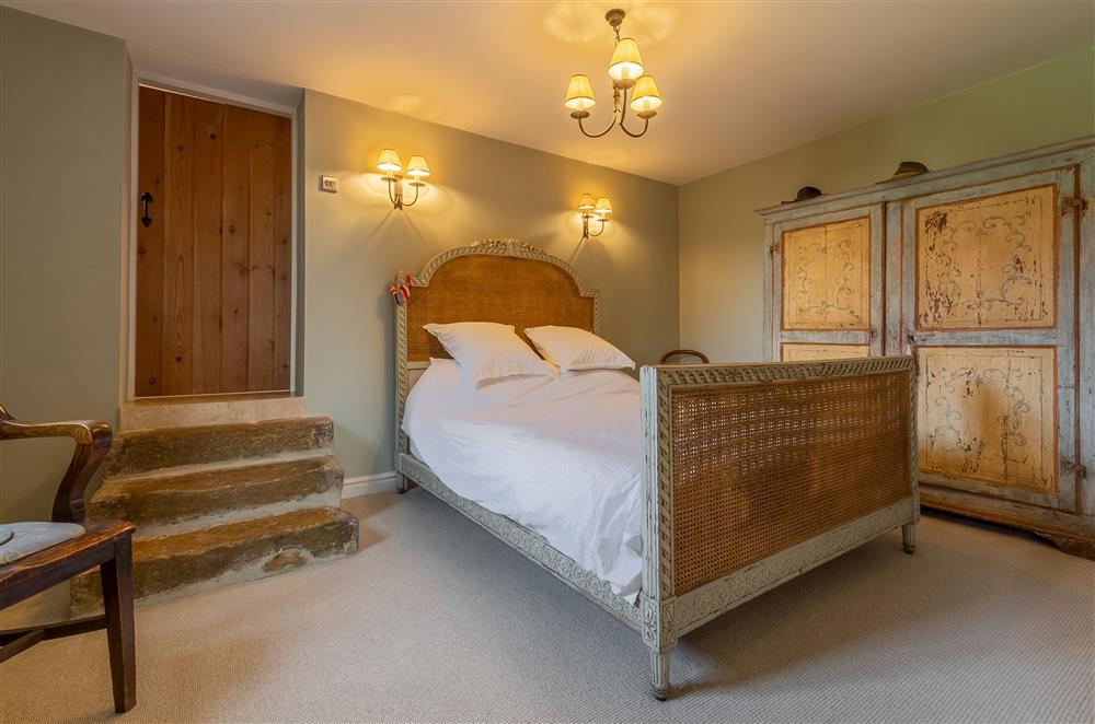 Master bedroom with antique French king-size bed at Five Acres, Boltby
