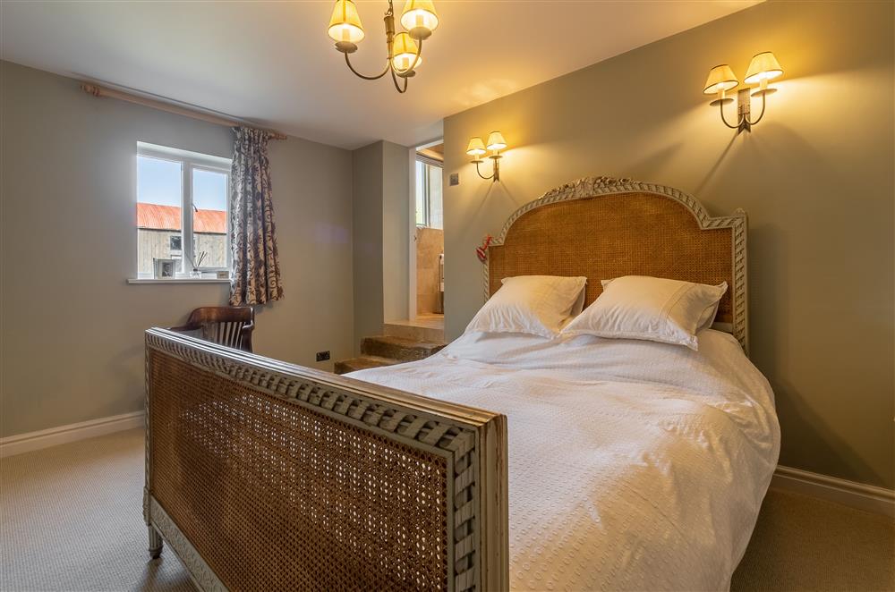 Master bedroom with relaxing wall lighting at Five Acres, Boltby