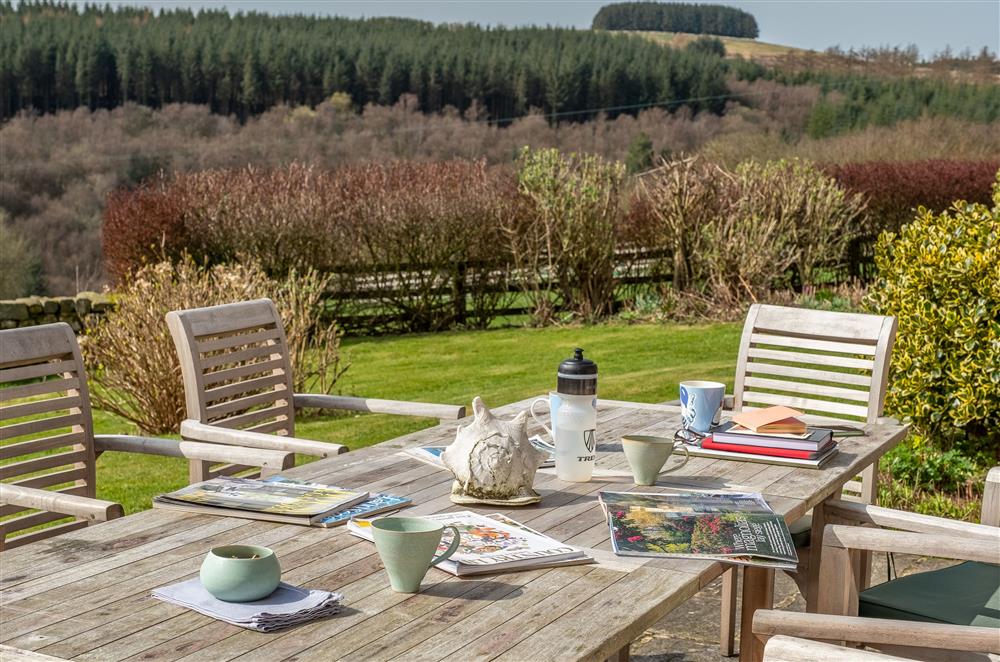 Sunny terrace with table and chairs at Five Acres, Boltby