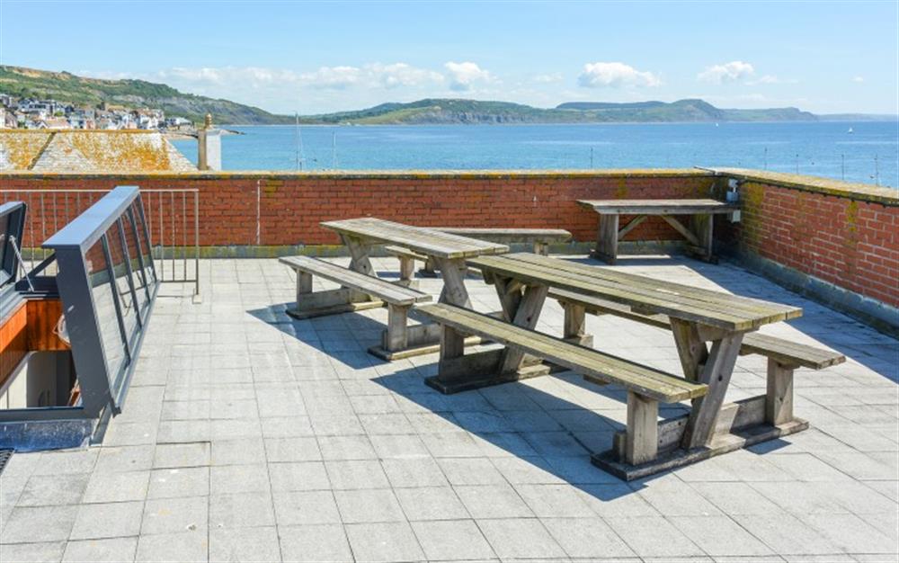 Al fresco dining on the roof terrace at Flat 1, Harbour House in Lyme Regis