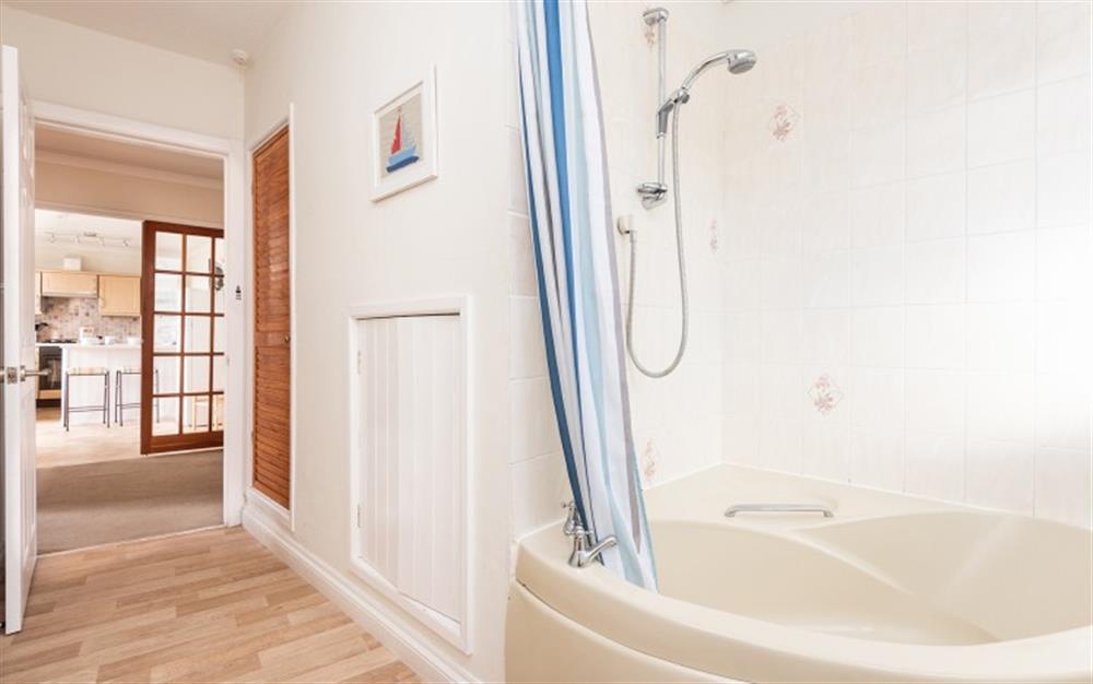Family bathroom with shower over bath at Flat 1, Harbour House in Lyme Regis