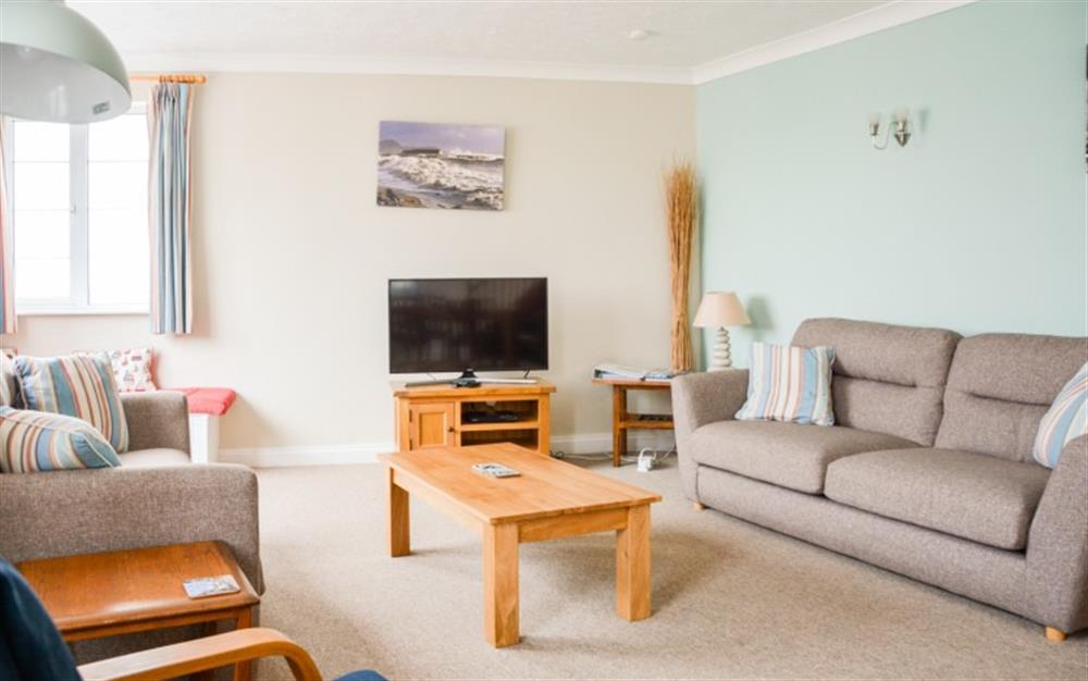 Relax in the living area at Flat 1, Harbour House in Lyme Regis