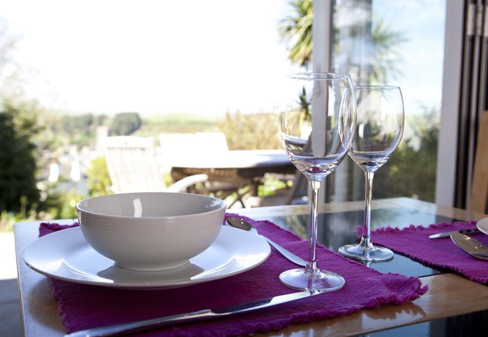 Dining table overlooking the garden at Flat 3 Albany House in Allenhayes Road, Salcombe