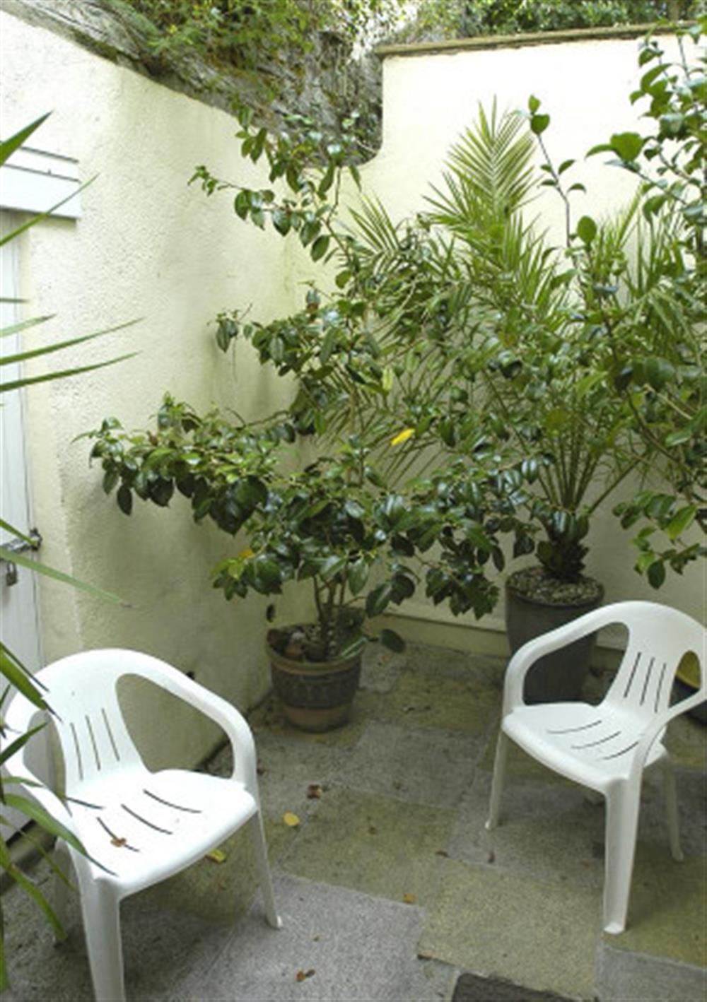 The rear courtyard, accessed through the second double bedroom. at Flat 4, Sandhills House in Salcombe