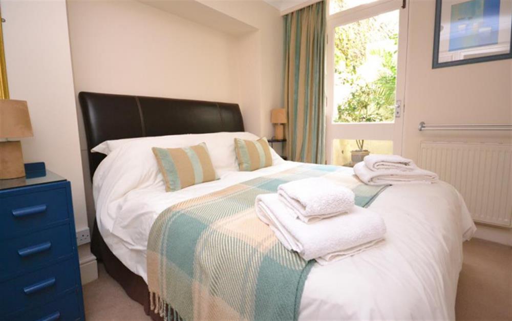 The second double bedroom with outside patio at Flat 4, Sandhills House in Salcombe