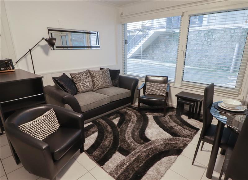 Relax in the living area at Flat 7, Tenby