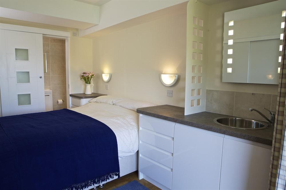 Bedroom area with King size bed at Flat 7 The Salcombe in Fore Street, Salcombe
