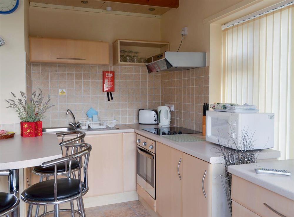 Kitchen and dining area (photo 2) at Flat F1 in Dawlish Warren, Devon, England