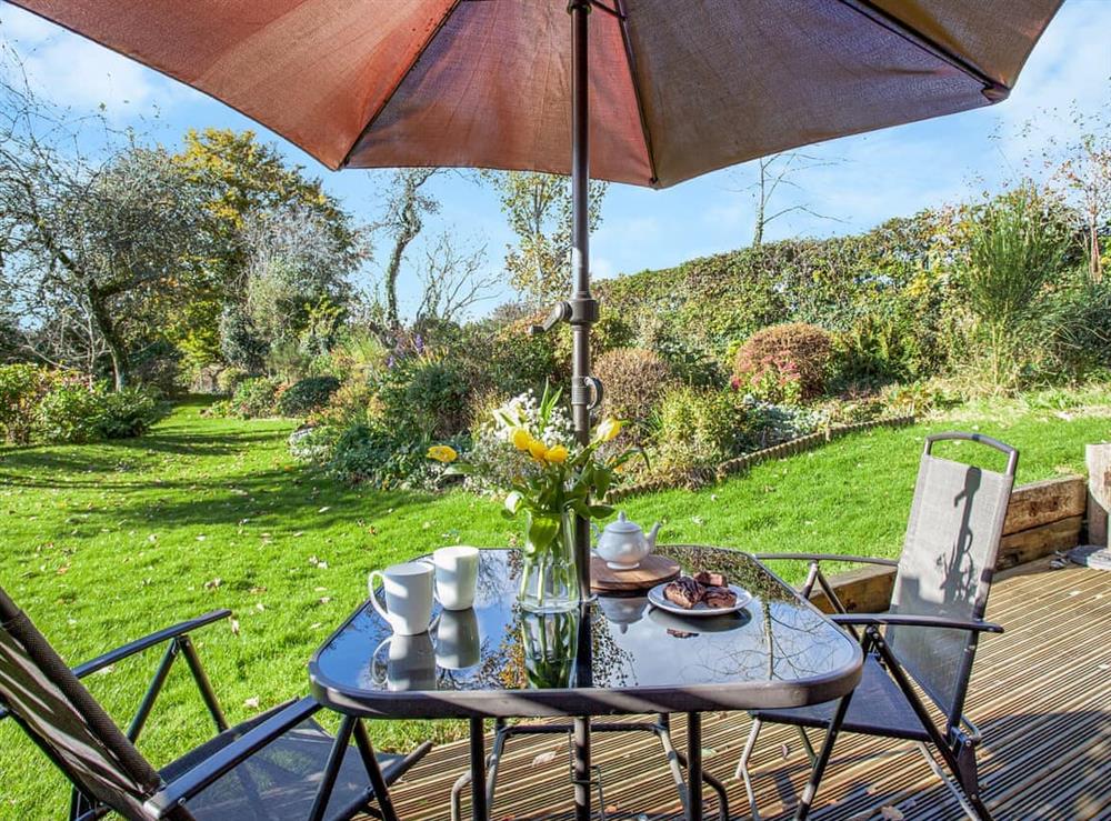 Sitting-out-area at Flaxpool Well Garden Room in Crowcombe, near Taunton, Somerset