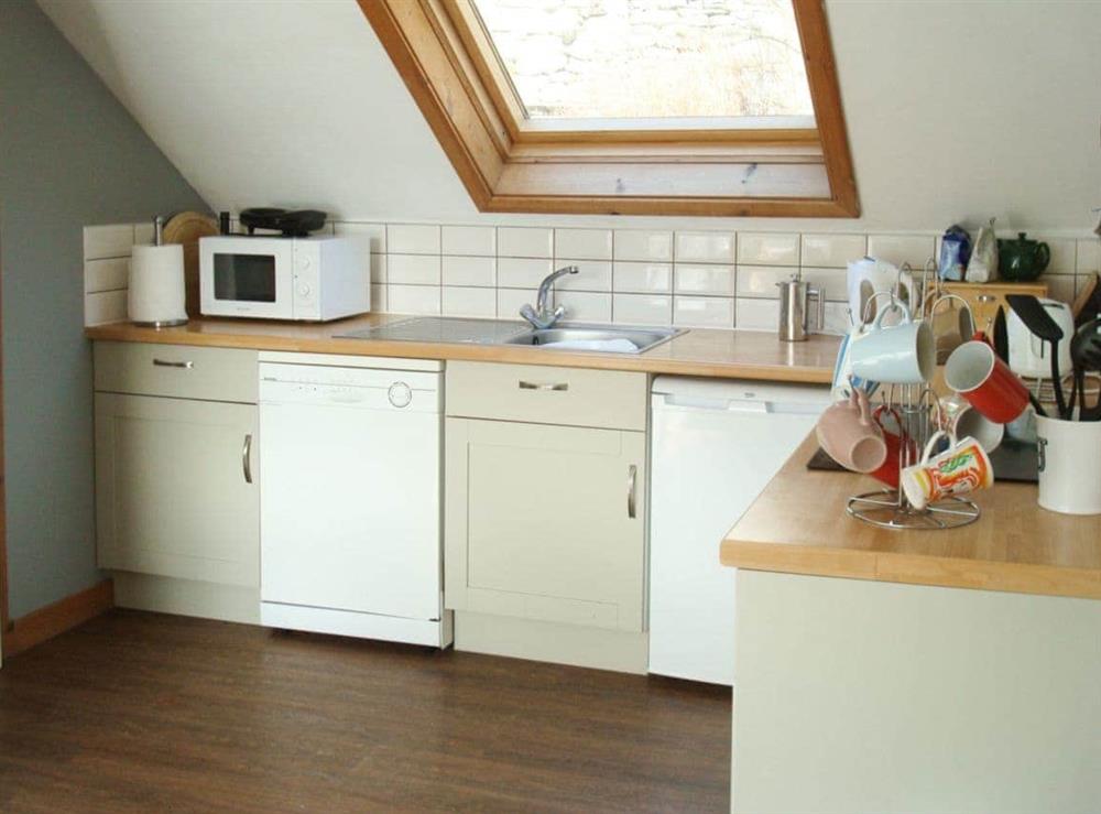 Well-equipped fitted kitchen at Fleet Cottage in Portree, Isle of Skye., Isle Of Skye