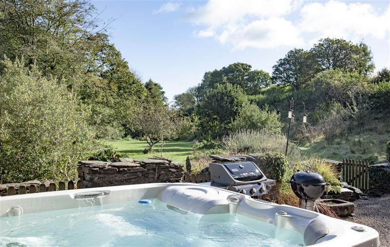 There is a swimming pool at Fletchers Farmhouse, Devon