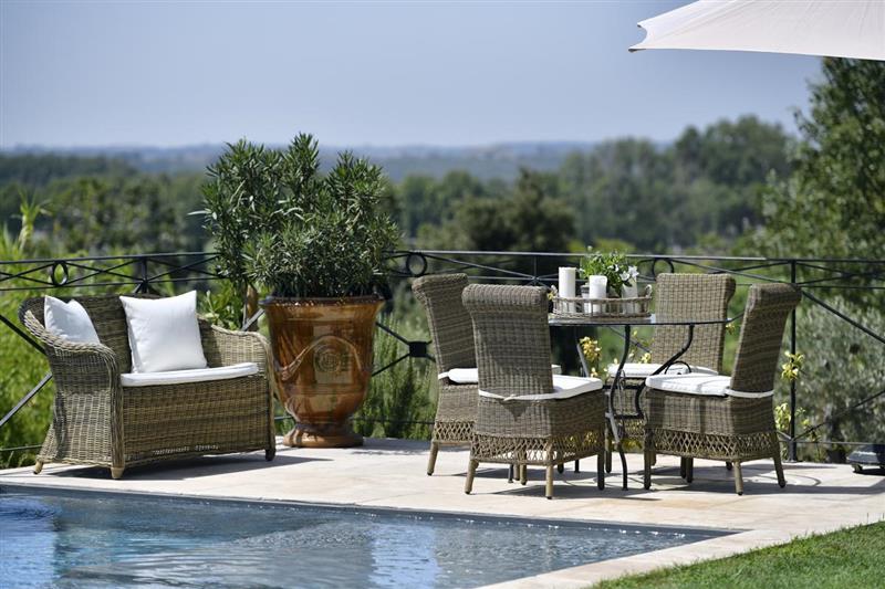 Swimming pool and seating at Fleurs De Provence, Avignon, France