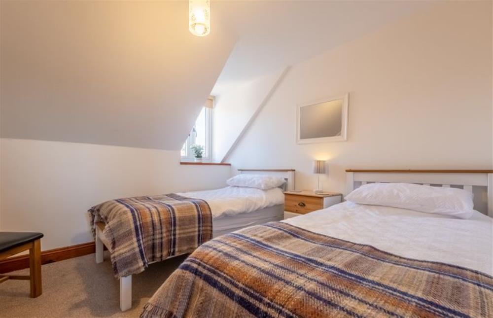 Bedroom two with 3’ full-size twin beds and hanging rail at Flint Barn, East Runton near Cromer