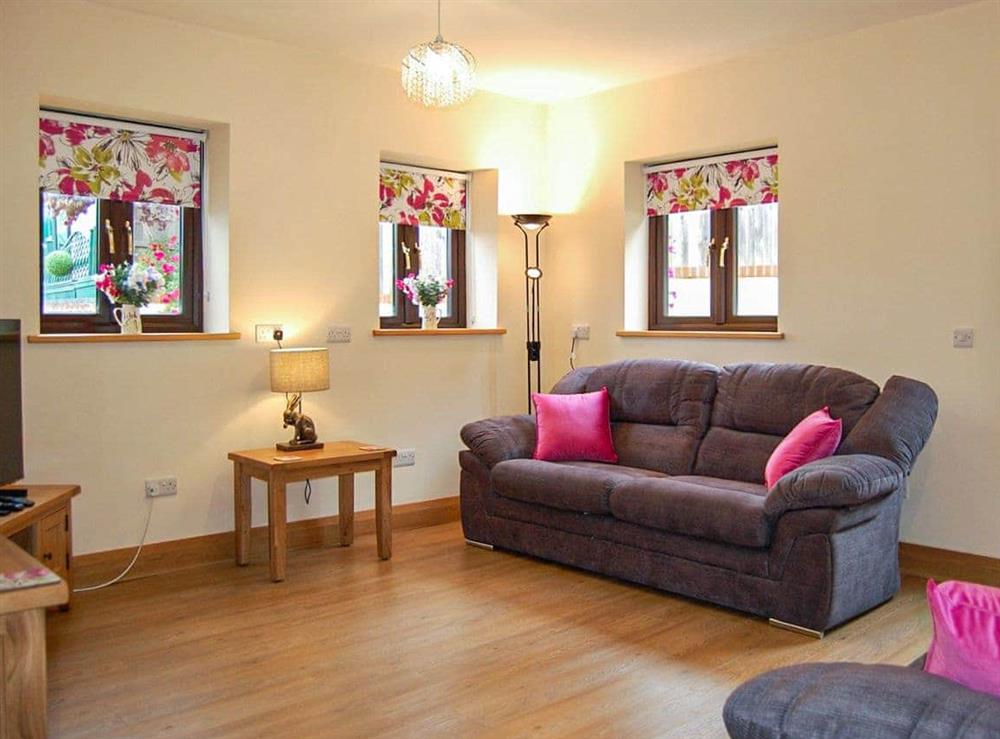 Living room at Flint Cottage in Roughton, near Cromer, Norfolk