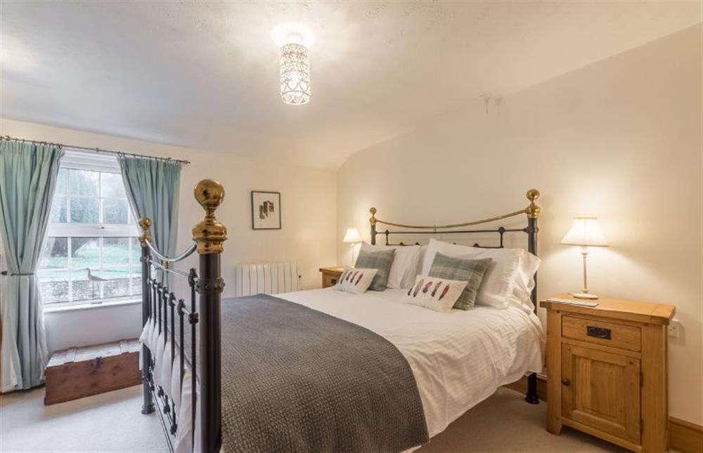 Double bedroom with views into the garden at Flint Cottage, Wenhaston 