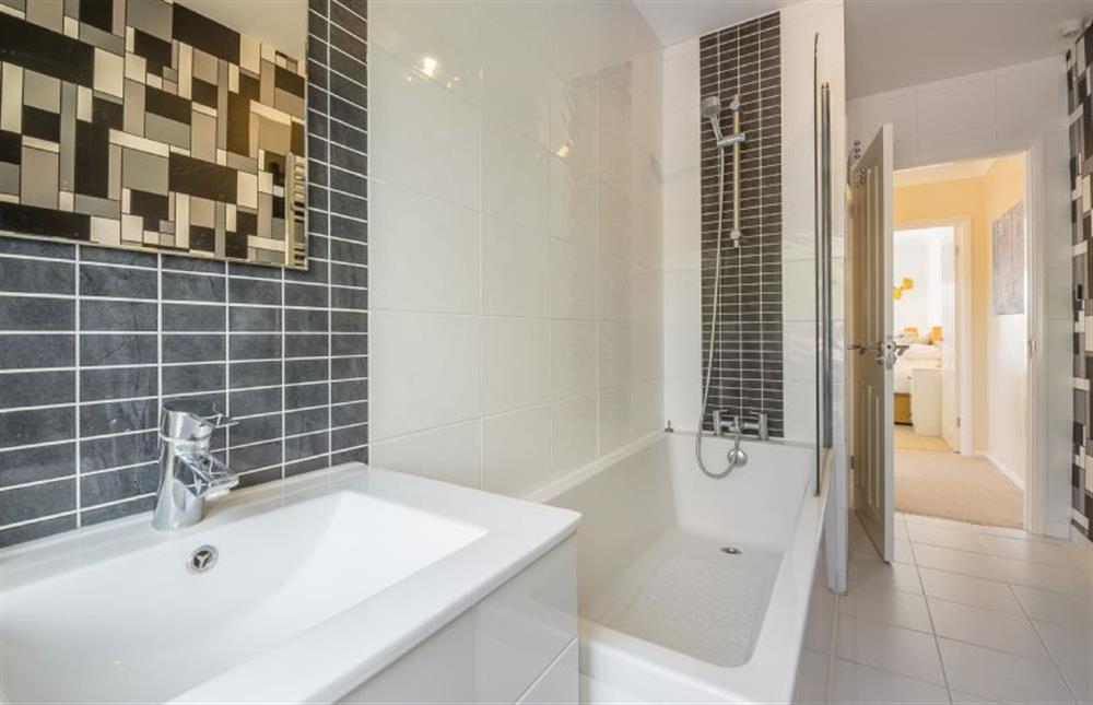 First floor:  Bathroom with bath with shower over, wash basin and WC at Flint House, Castle Acre near Kings Lynn
