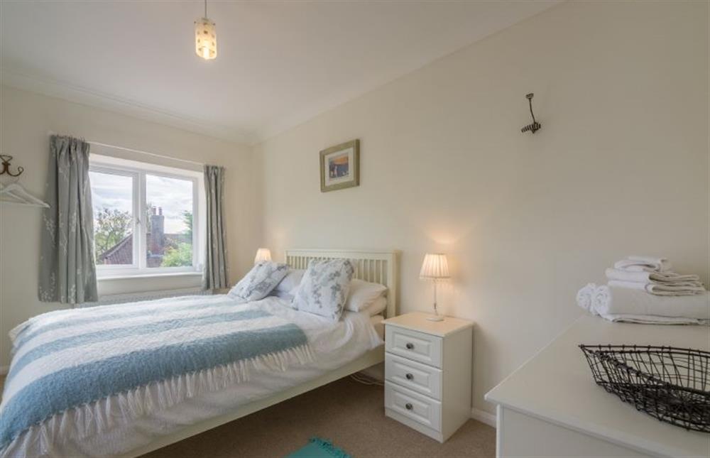 First floor:  Bedroom one with king size bed at Flint House, Castle Acre near Kings Lynn