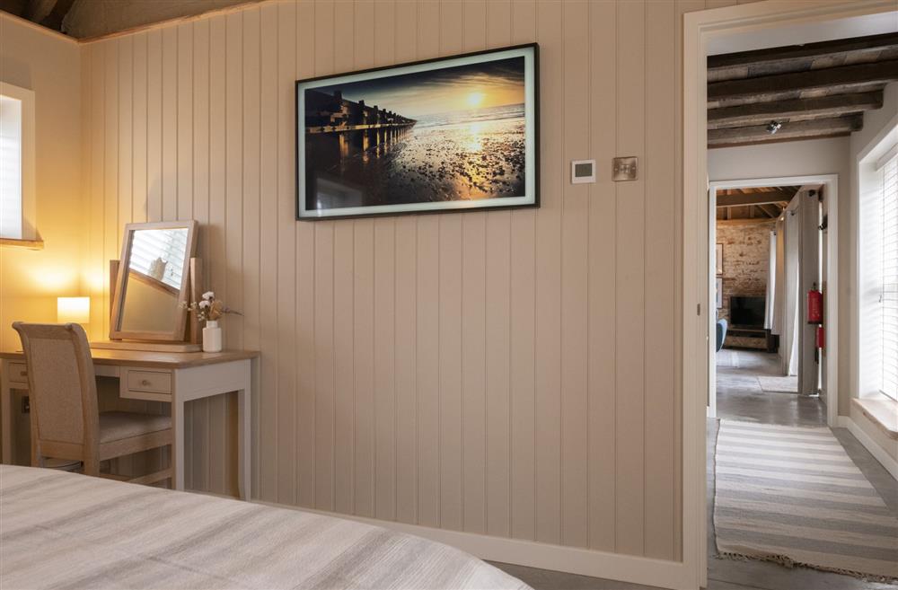 Bedroom one with a Samsung Frame Smart television at Flittermouse Barn, Hornsea