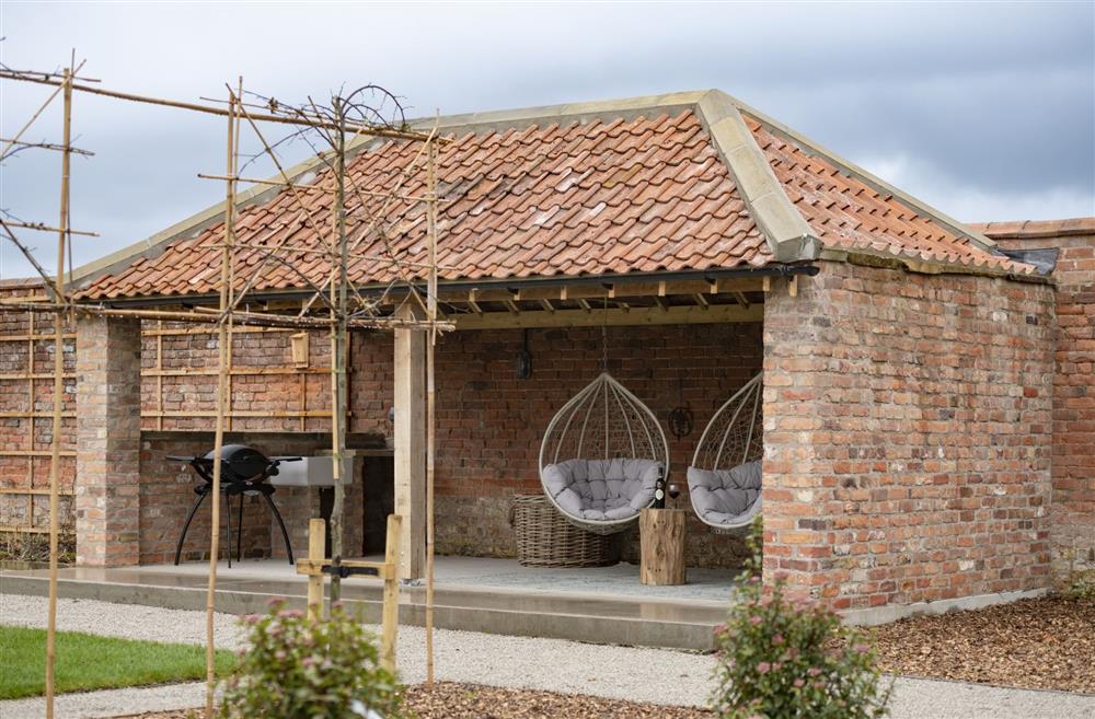 Spend the evening under the covered seating area  at Flittermouse Barn, Hornsea