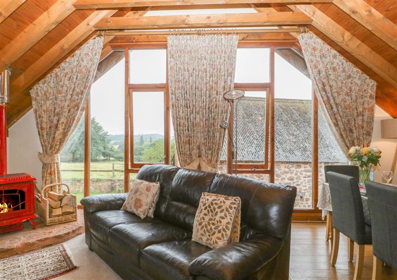 Relax in the living area at Floras Barn, Crowcombe