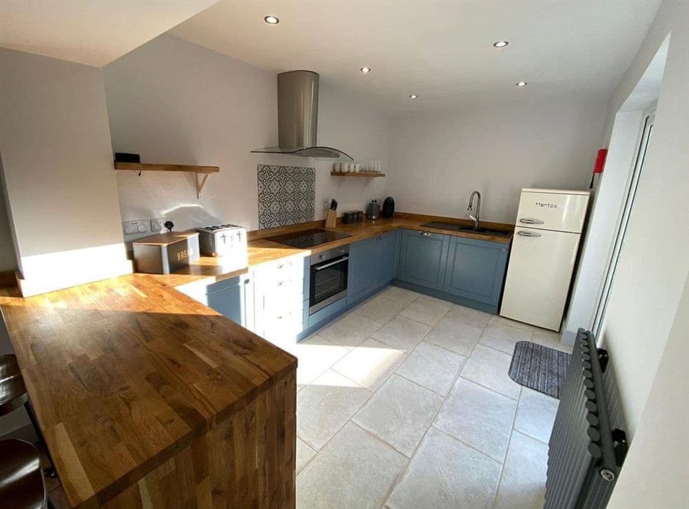 Well presented kitchen with breakfast bar at Florence Cottage in Hunstanton, Norfolk