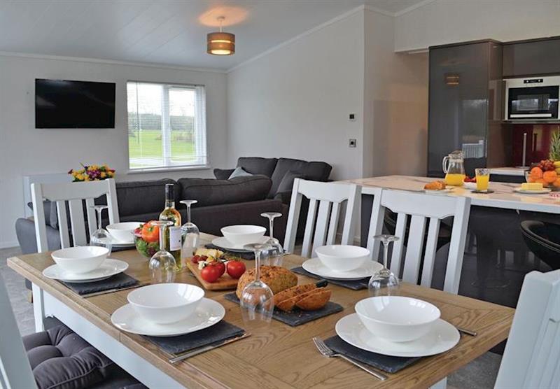 Dining and seating area in the Hazel Lodge at Florence Springs Lakeside Lodges in St Florence, Tenby