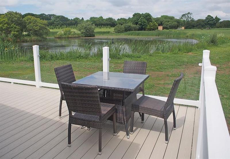 Outdoor seating at the Maple Lodge at Florence Springs Lakeside Lodges in St Florence, Tenby